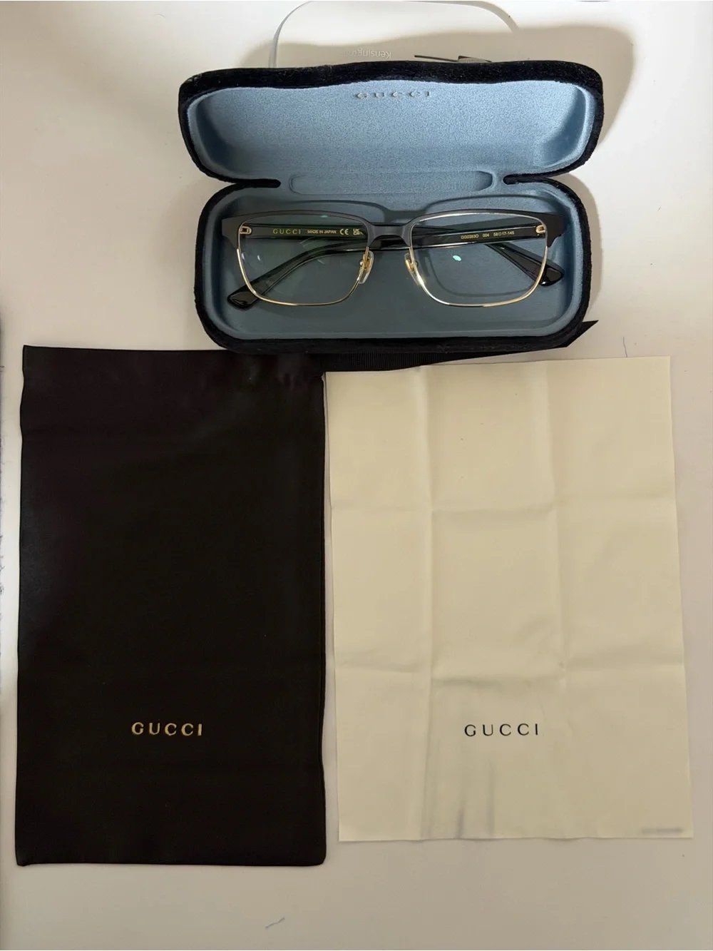 Gucci Men's Black and Gold Rimmed Eyeglasses